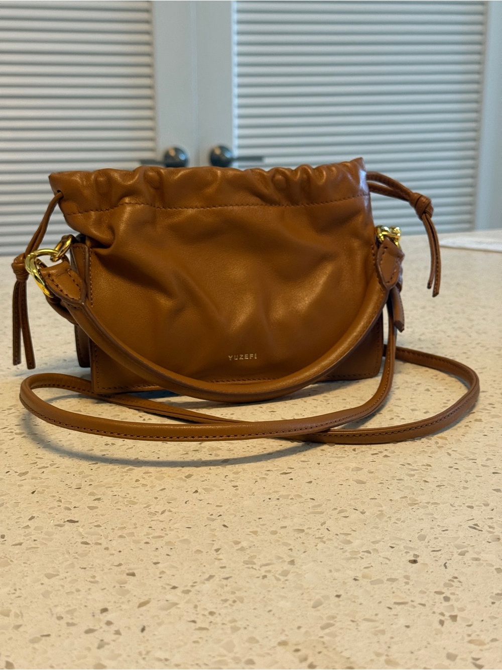 Yuzefi Cognac Leather Drawstring Crossbody Bag